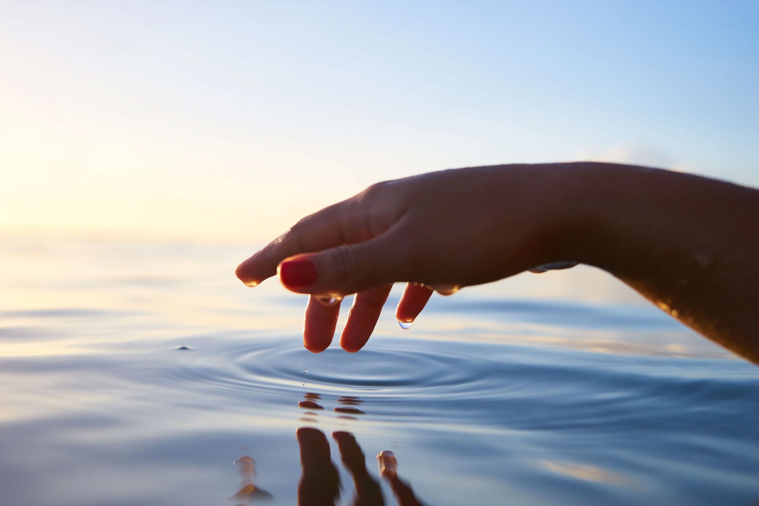 Hand Touching Water Hand Touching Water